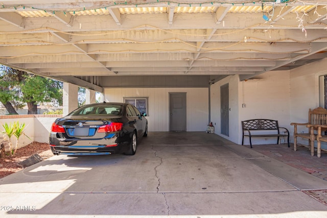 garage featuring an attached carport