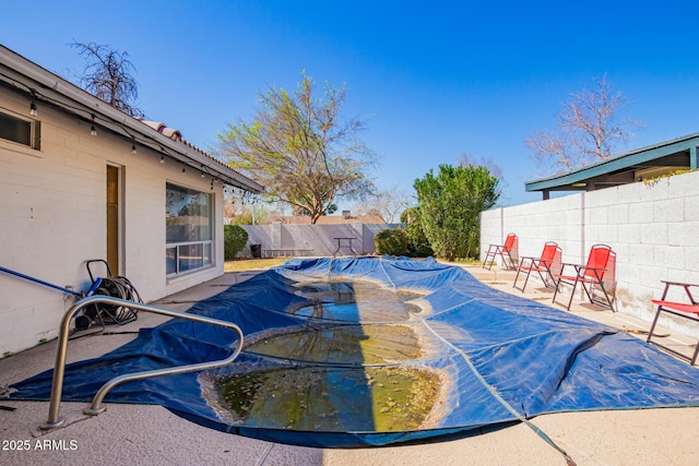 view of pool featuring a fenced backyard