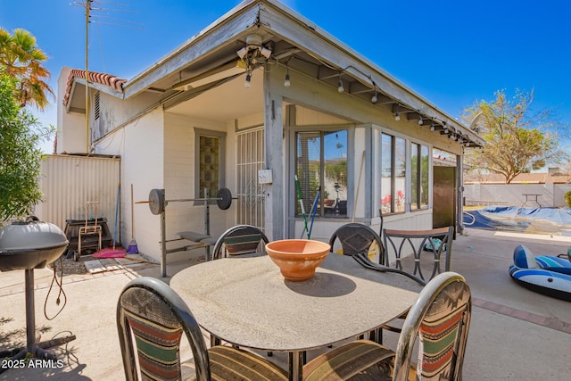 view of patio / terrace featuring fence