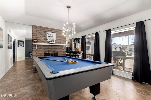 playroom with arched walkways, tile patterned flooring, billiards, baseboards, and a brick fireplace