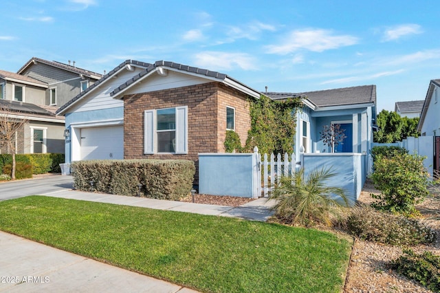 view of front of property with a garage and a front yard