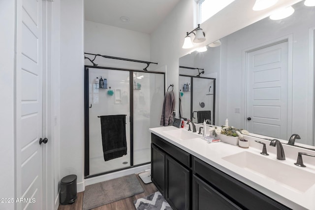 bathroom featuring vanity, hardwood / wood-style floors, and walk in shower