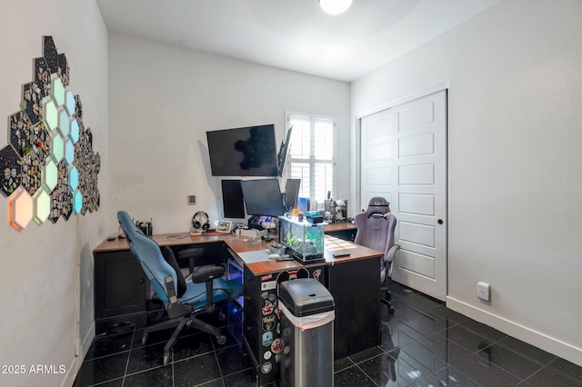 office space with dark tile patterned floors