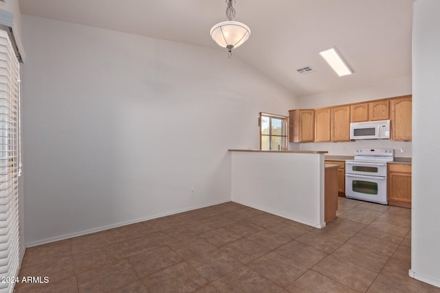 kitchen with lofted ceiling, tile patterned flooring, pendant lighting, and white appliances