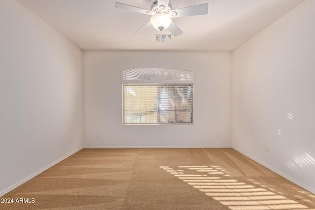 carpeted empty room with ceiling fan