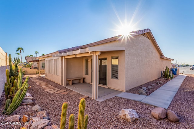 back of property with a patio area