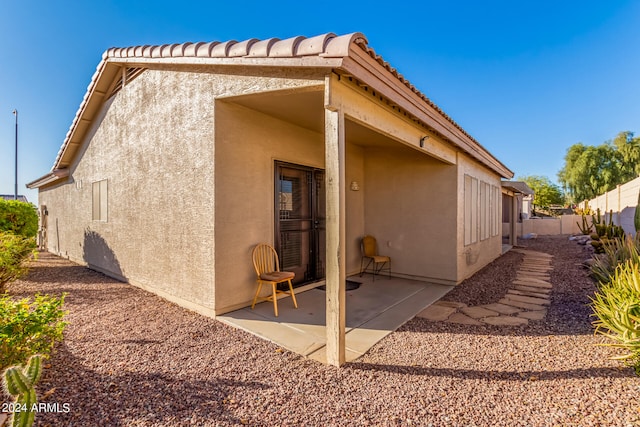 back of property with a patio area