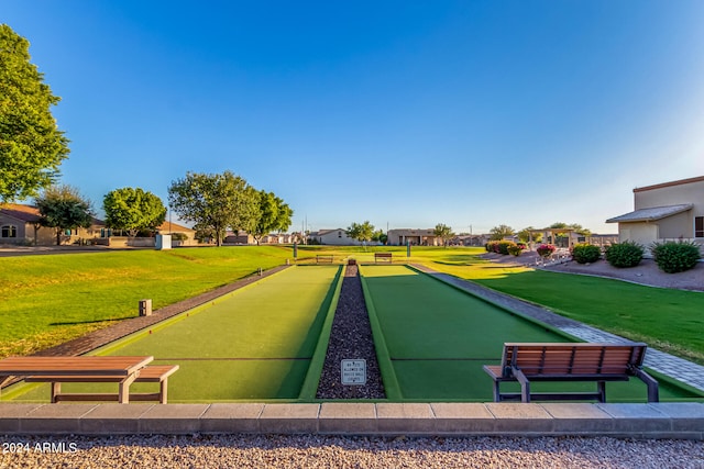 view of home's community with a yard