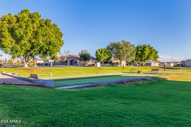 surrounding community with a yard