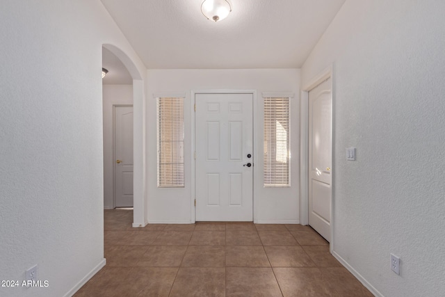 foyer entrance featuring tile patterned floors