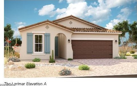 mediterranean / spanish house with a garage