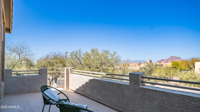 balcony featuring a mountain view