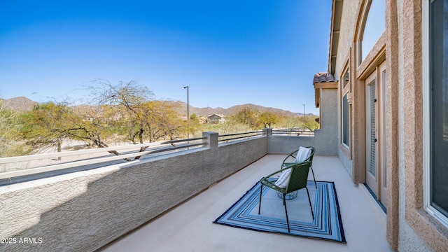 balcony featuring a mountain view