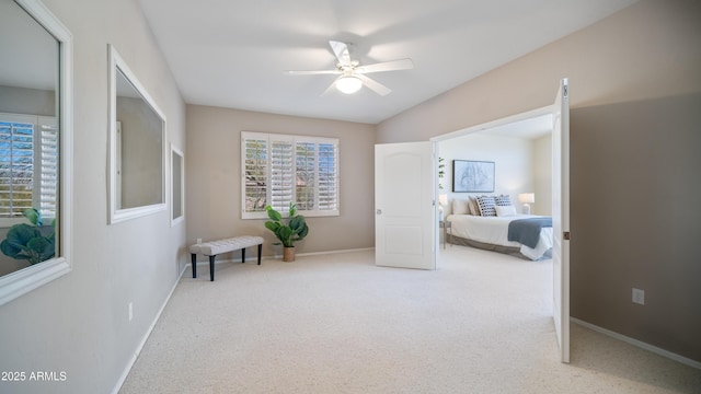 carpeted bedroom with baseboards and ceiling fan