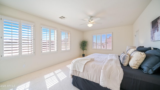 bedroom featuring visible vents and ceiling fan