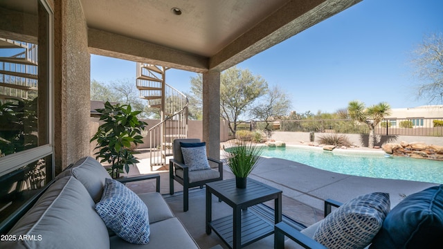 view of patio / terrace featuring a fenced in pool, an outdoor hangout area, and a fenced backyard