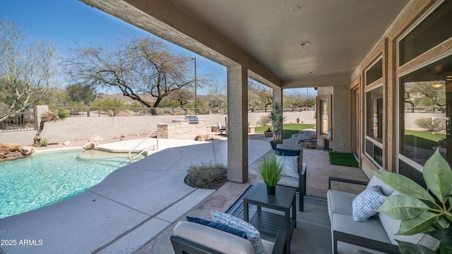 view of patio / terrace featuring an outdoor living space, a fenced in pool, and a fenced backyard