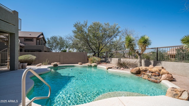 view of swimming pool featuring a fenced in pool and a fenced backyard