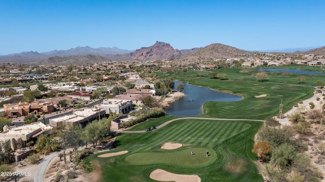 aerial view featuring a water and mountain view and view of golf course