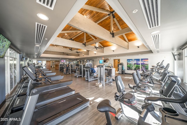 exercise room with visible vents, ceiling fan, wood ceiling, vaulted ceiling, and wood finished floors