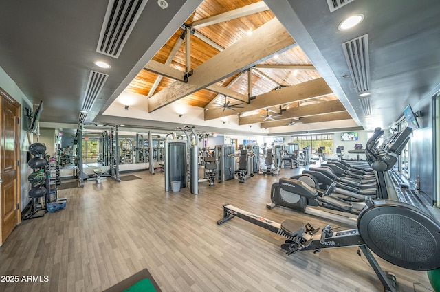 exercise room featuring wood finished floors, wooden ceiling, and vaulted ceiling