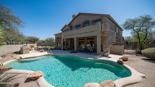 view of swimming pool with a fenced in pool, a patio, a fenced backyard, and stairs