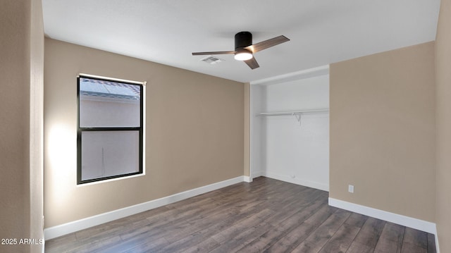 unfurnished bedroom with hardwood / wood-style floors, ceiling fan, and a closet