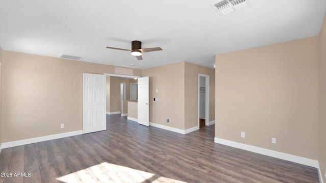 unfurnished room featuring ceiling fan and dark hardwood / wood-style flooring