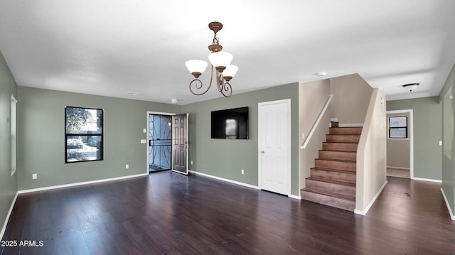 interior space with dark hardwood / wood-style flooring and an inviting chandelier