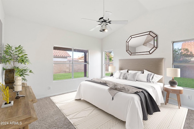 carpeted bedroom with ceiling fan and lofted ceiling