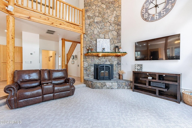 carpeted living room with a high ceiling