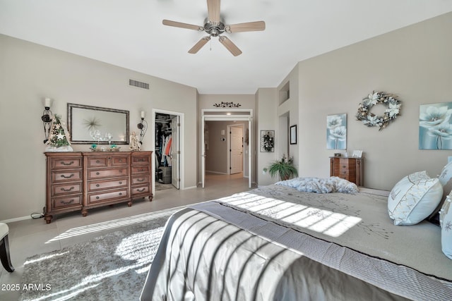 bedroom featuring ceiling fan, a spacious closet, and a closet