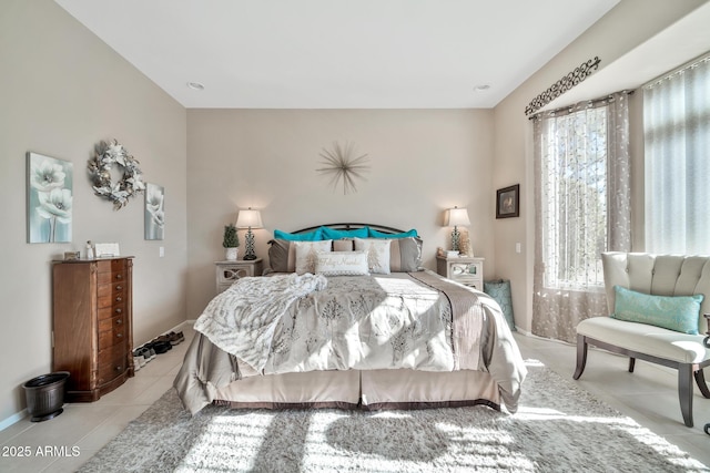 bedroom with light tile patterned flooring