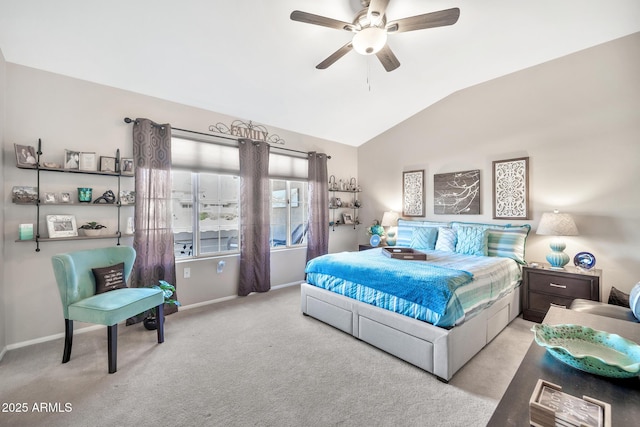 bedroom with ceiling fan, light carpet, and vaulted ceiling