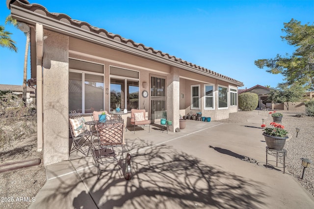 rear view of house with a patio area