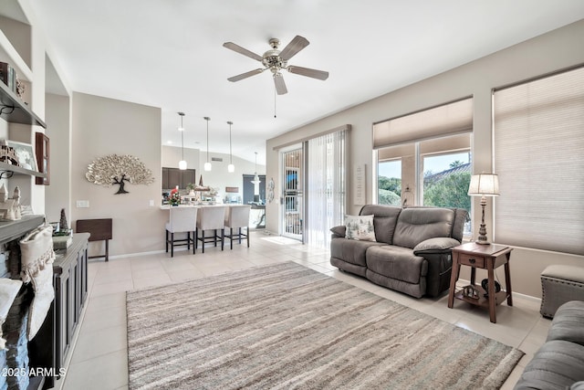 living room featuring ceiling fan and light tile patterned flooring