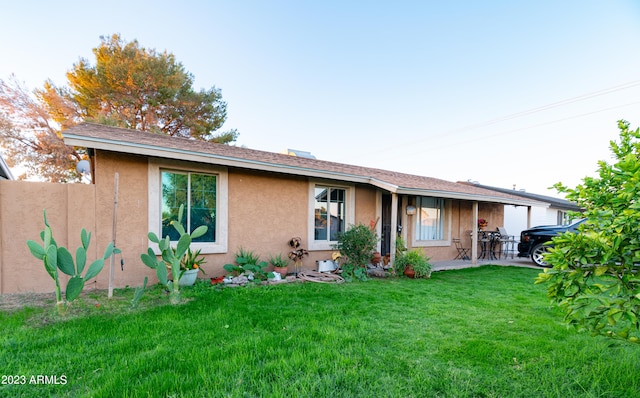 exterior space featuring a patio and a front yard