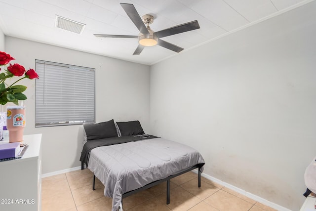 bedroom featuring light tile patterned floors and ceiling fan