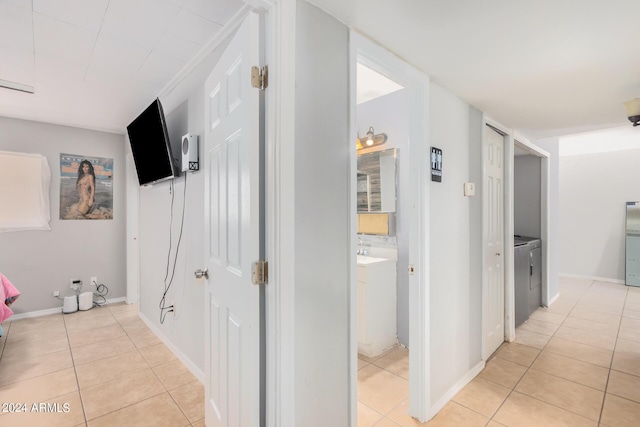 corridor with light tile patterned flooring