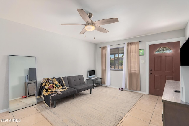 living room featuring light tile patterned flooring and ceiling fan