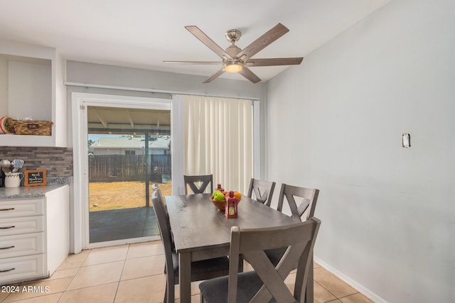 dining room with light tile patterned floors and ceiling fan