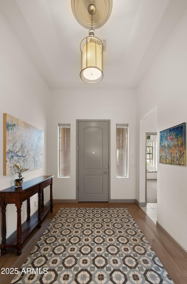 foyer with hardwood / wood-style flooring