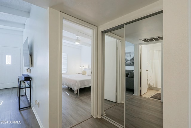 hallway featuring hardwood / wood-style flooring