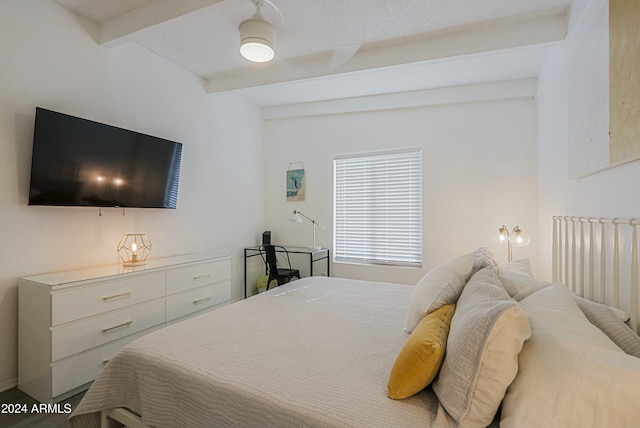 bedroom featuring beamed ceiling