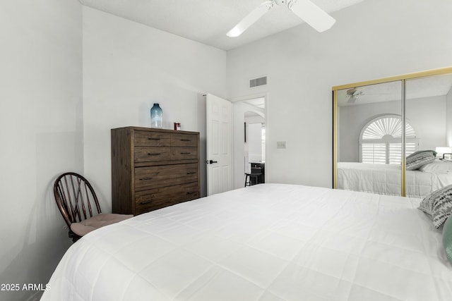 bedroom featuring ceiling fan and a closet