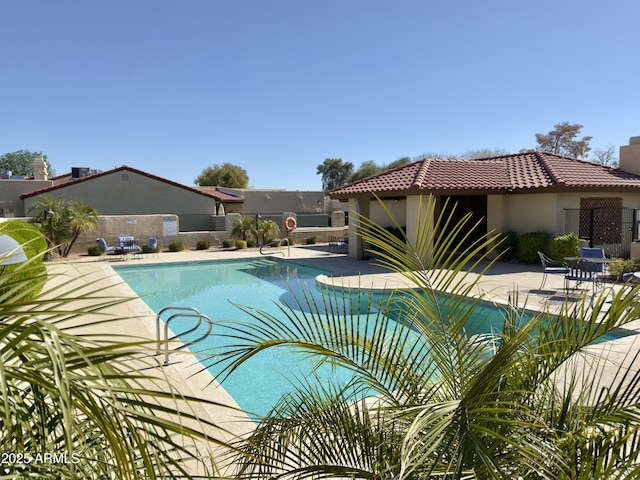 view of pool featuring a patio