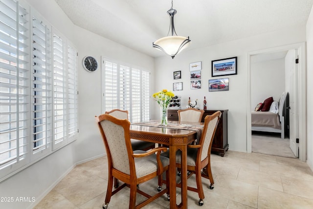 dining room featuring light tile patterned flooring