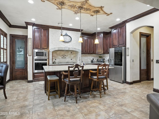 2822 E Constance Way, Phoenix, AZ 85042 - kitchen featuring appliances with stainless steel finishes, crown molding, arched walkways, tasteful backsplash, and recessed lighting