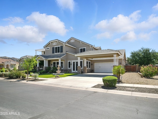 2822 E Constance Way, Phoenix, AZ 85042 - craftsman house with an attached garage, concrete driveway, stone siding, and board and batten siding