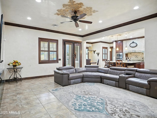 2822 E Constance Way, Phoenix, AZ 85042 - living room with a ceiling fan, recessed lighting, ornamental molding, and light tile patterned floors
